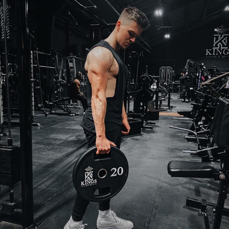 Interior of a professional gym with weight training equipment and mirrors